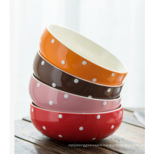 Glazed porcelain salad bowl with dots.